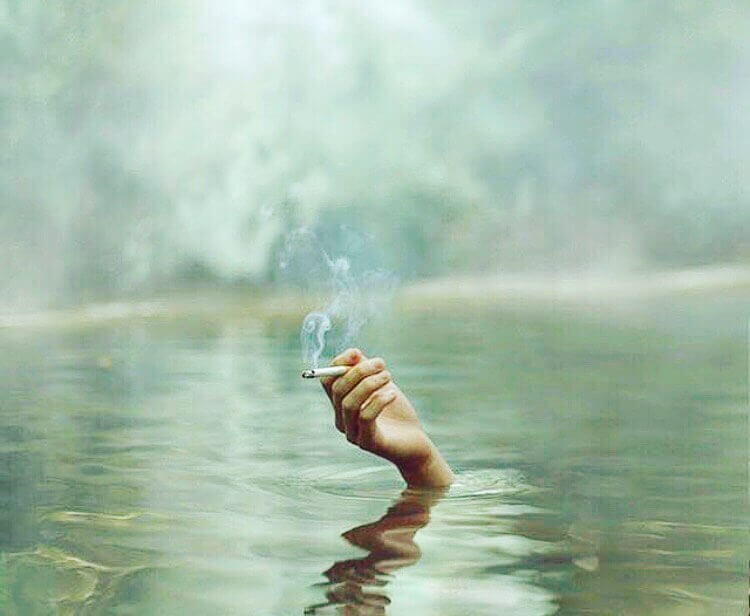 dont get wet a hand reaching out of a lake holding mountain smokes hemp cbd smokes