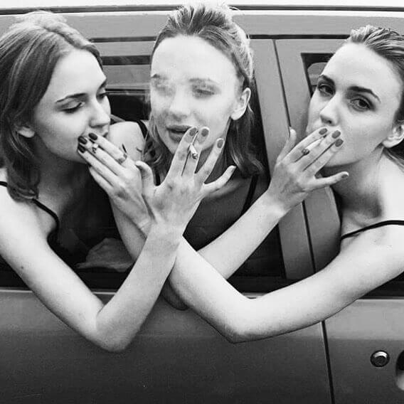 sharing cigarettes three women in a car sharing mountain smokes hemp cbd smokes