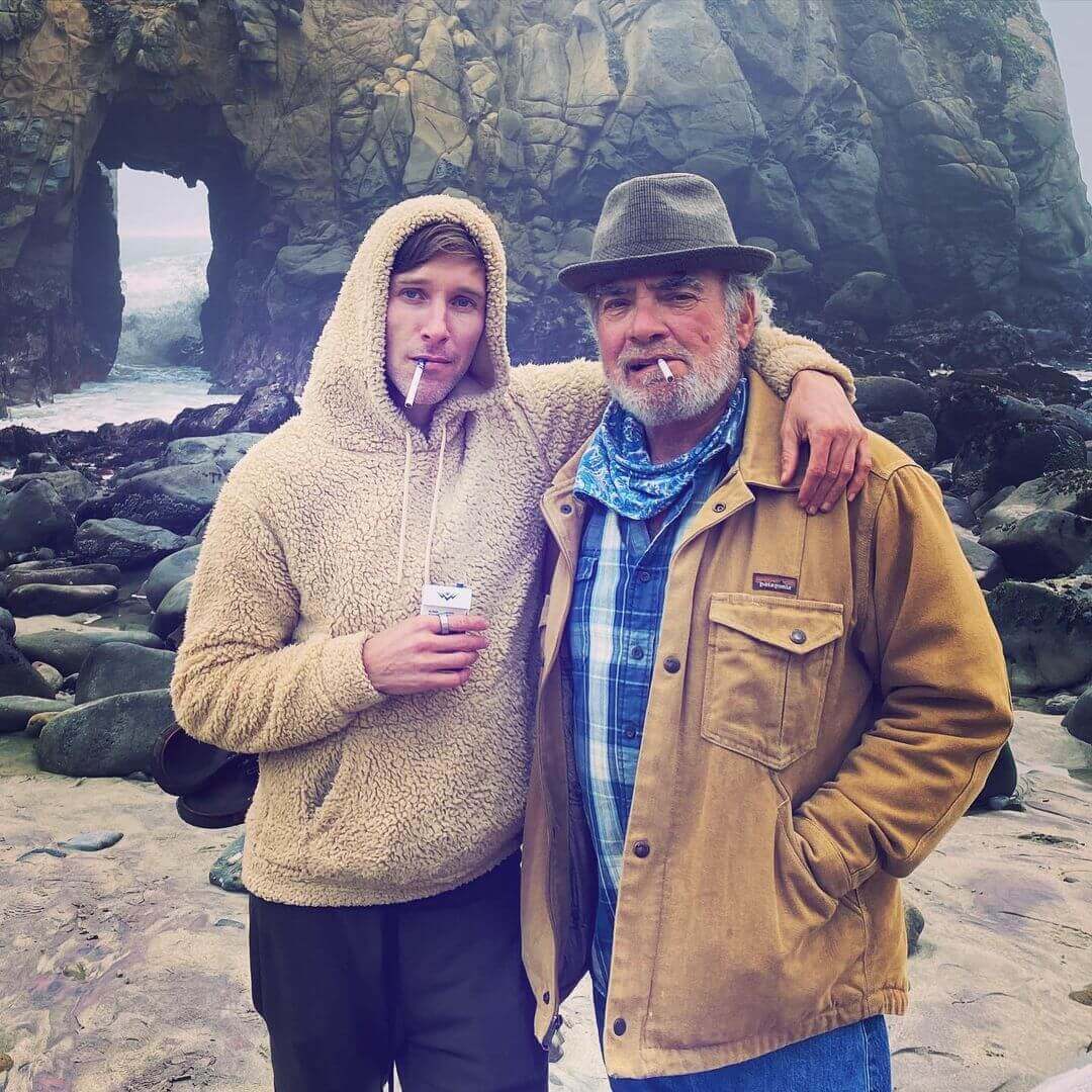 smoking outside two men smoking mountain smokes hemp cbd smokes in nature