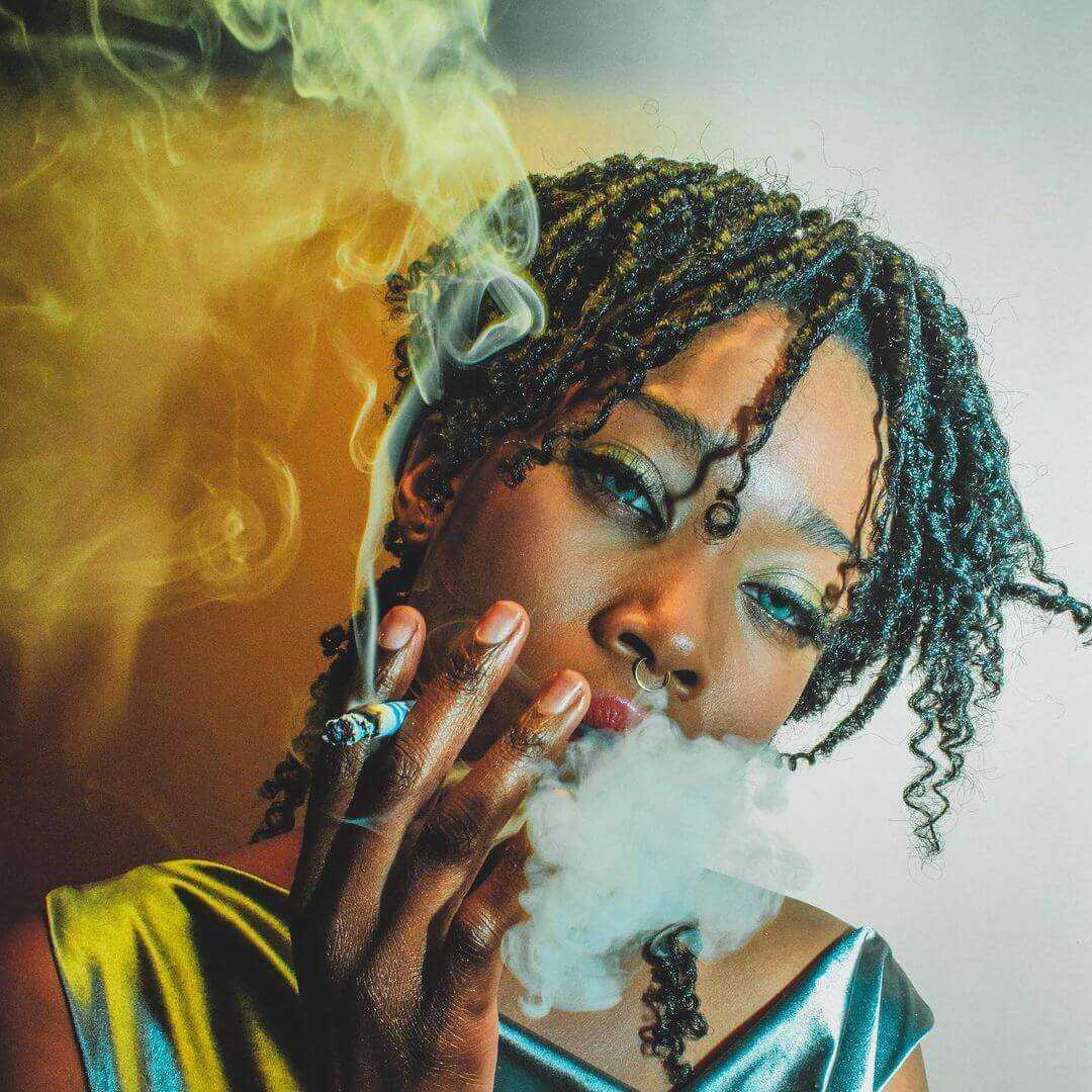 woman smoking two men smoking mountain smokes hemp cbd smokes in nature